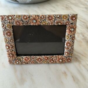 floral 4 by 6 picture frame with bedazzles on frame 61/2 wide by 5 inches height